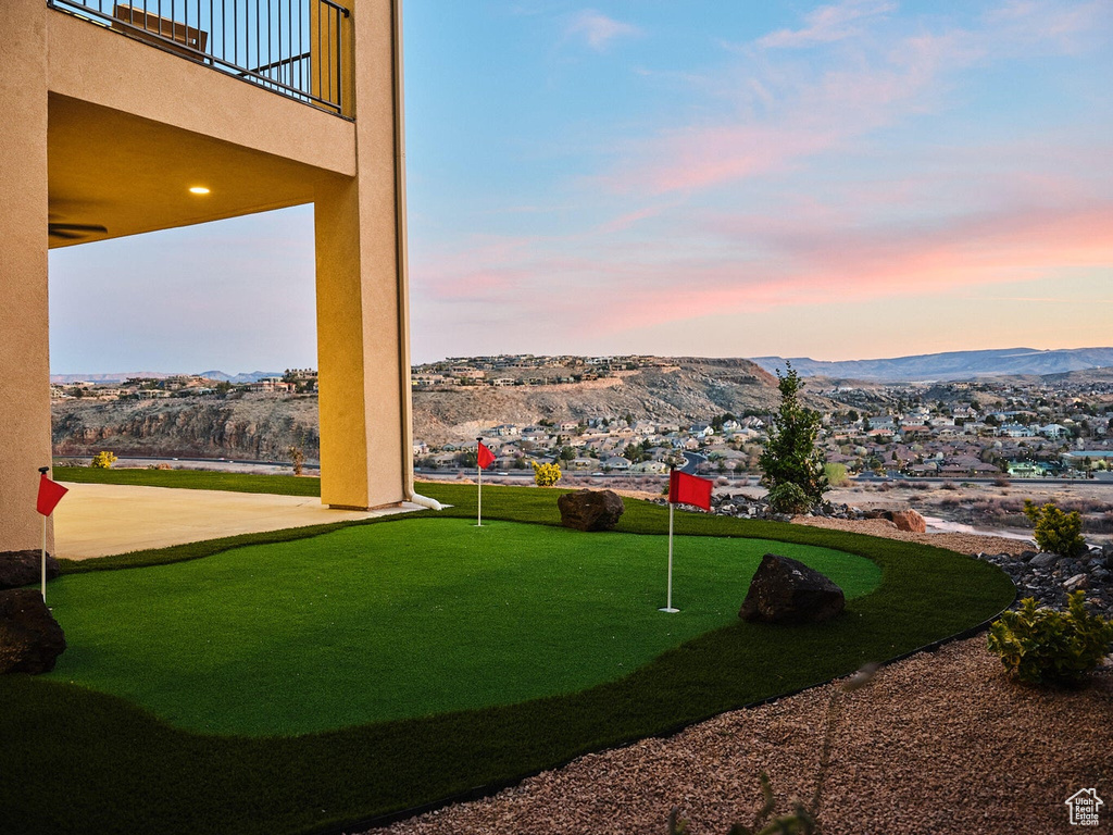 View of yard featuring a mountain view and a balcony