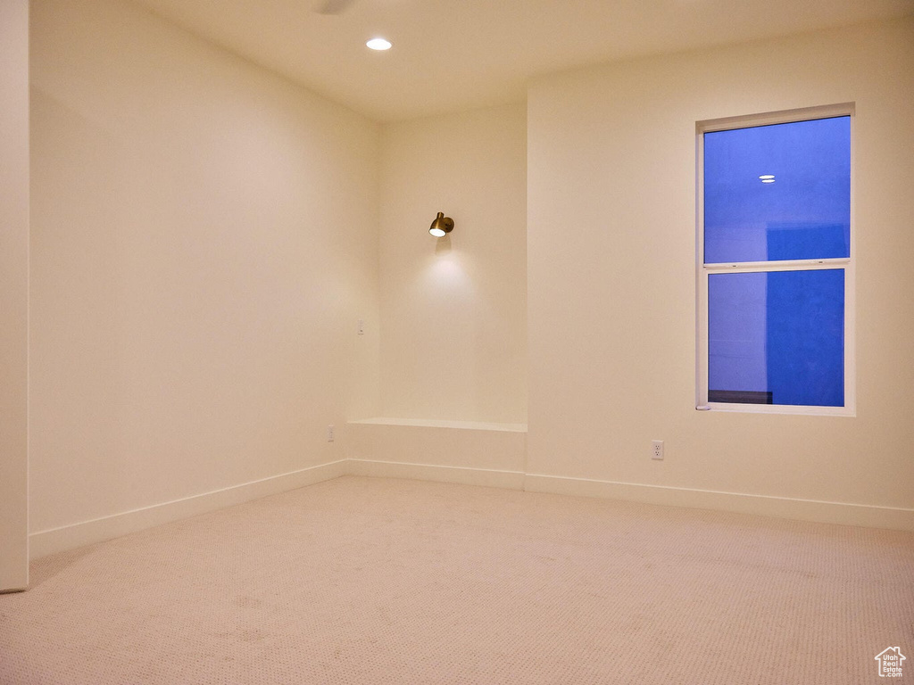 Spare room featuring recessed lighting, carpet flooring, and baseboards