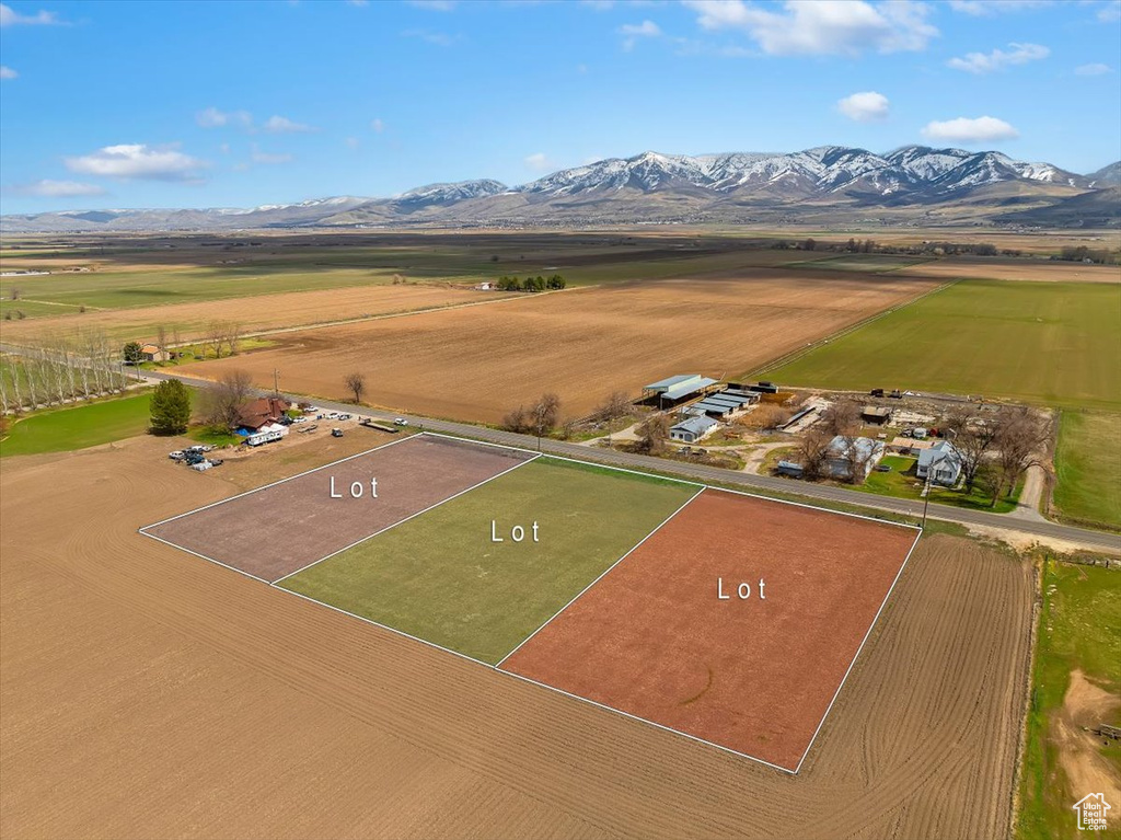Birds eye view of property with a rural view and a mountain view
