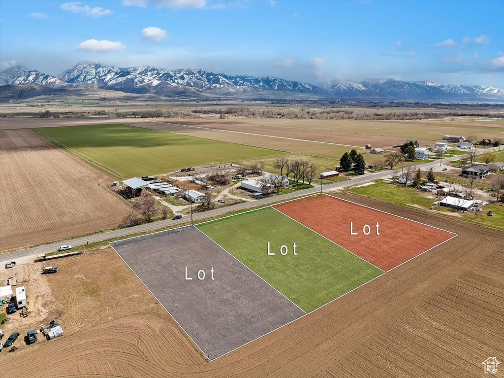 Birds eye view of property with a rural view and a mountain view