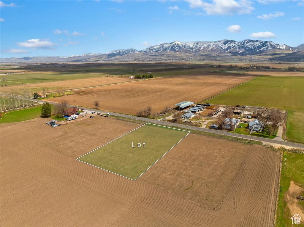 Birds eye view of property with a rural view and a mountain view