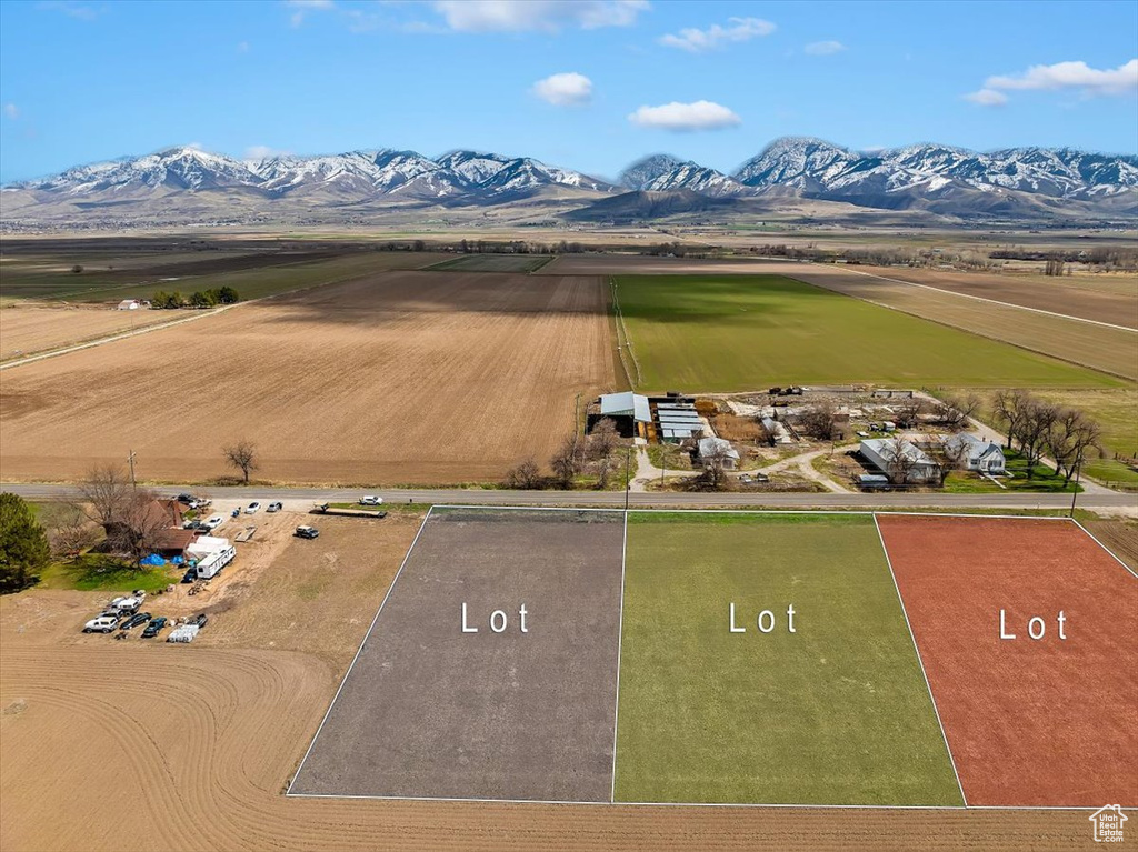 Birds eye view of property with a mountain view and a rural view