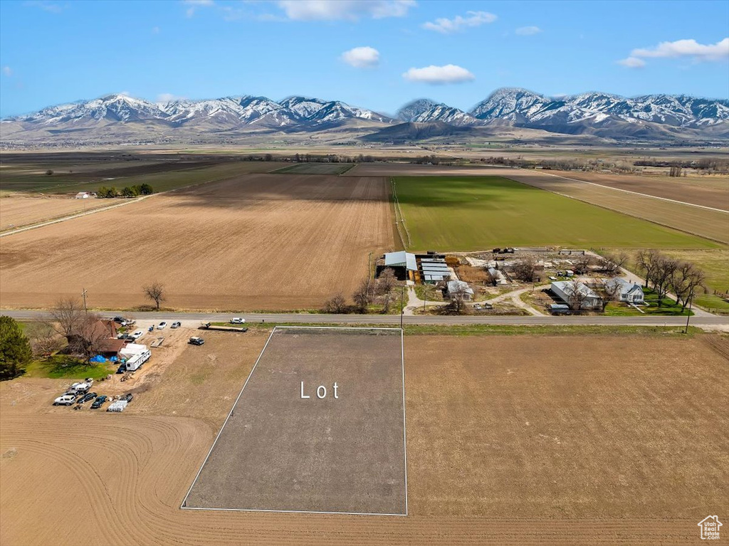 Birds eye view of property with a rural view and a mountain view