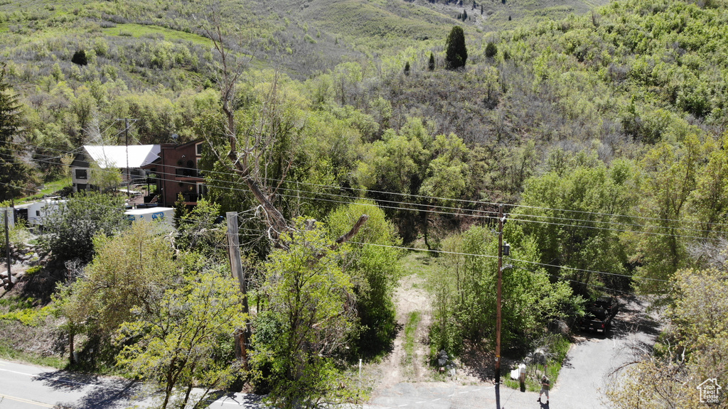 View from above of property with a heavily wooded area