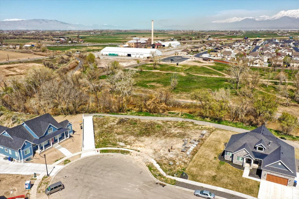 Birds eye view of property with a mountain view