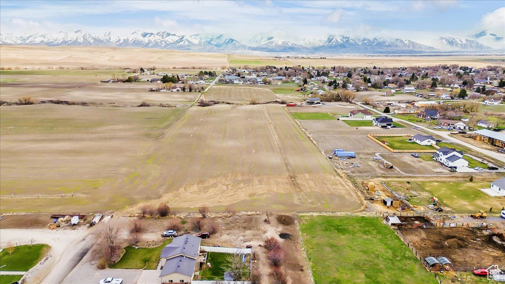 Aerial view featuring a rural view and a mountain view