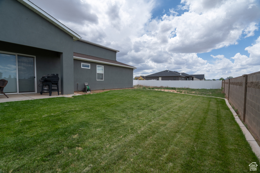 View of yard with a patio