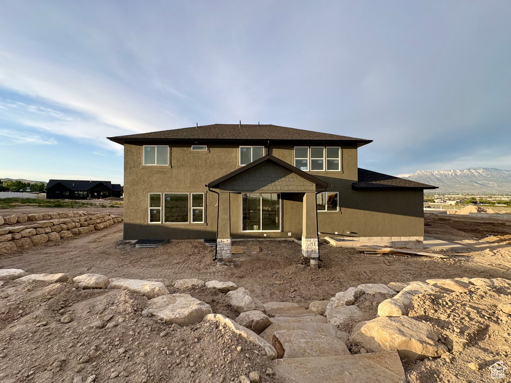 Back of house with a mountain view