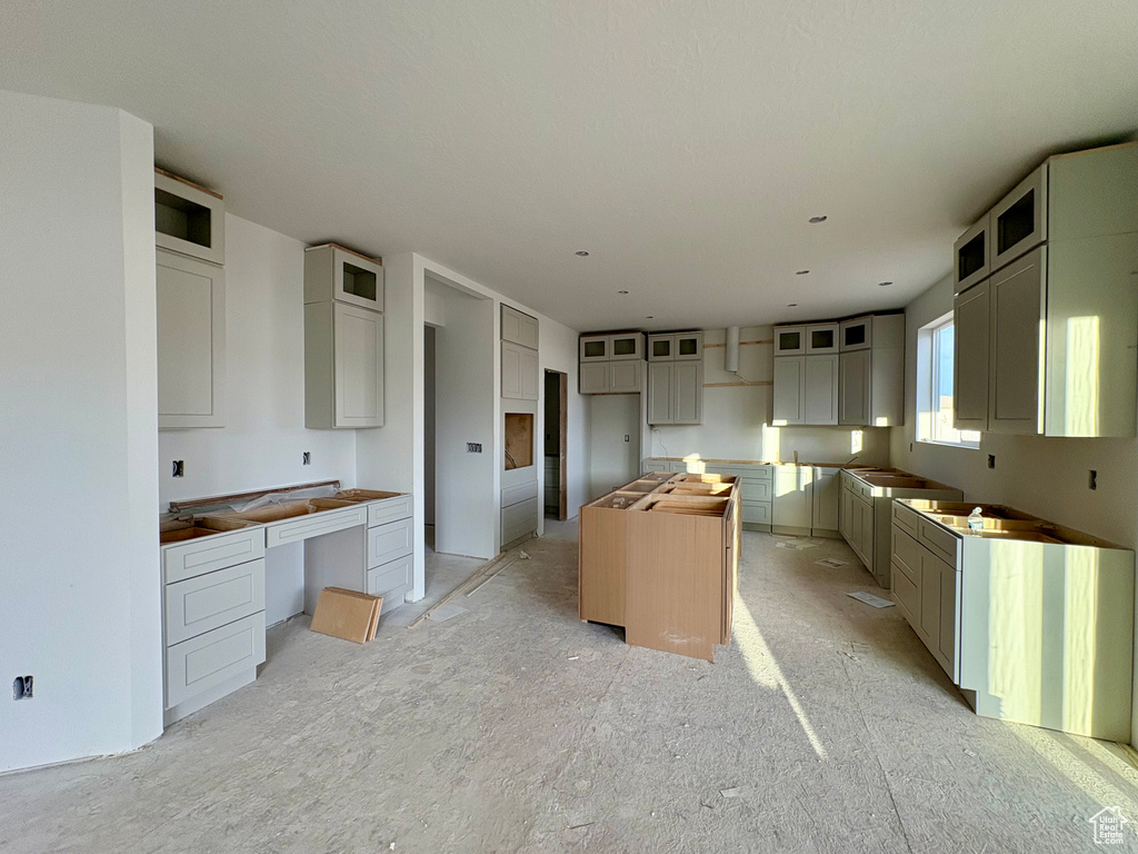 Kitchen featuring a center island and glass insert cabinets