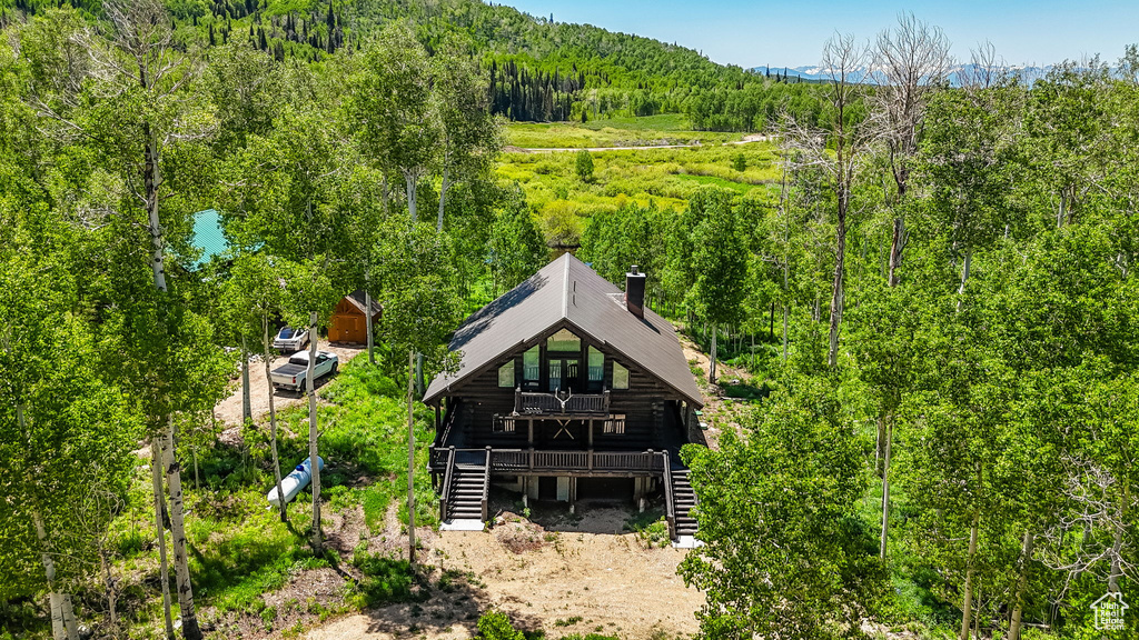 View from above of property with a forest