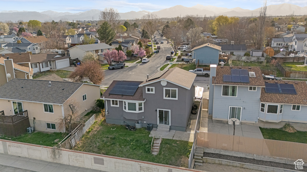 Birds eye view of property featuring a mountain view and a residential view
