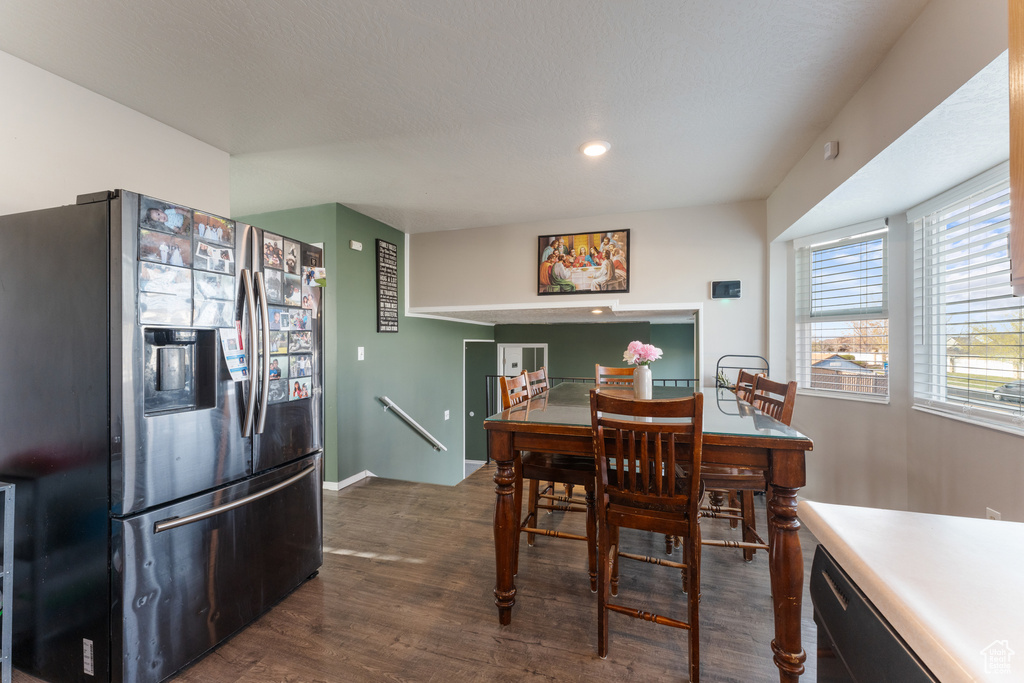 Dining room with recessed lighting, dark wood-style floors, and baseboards
