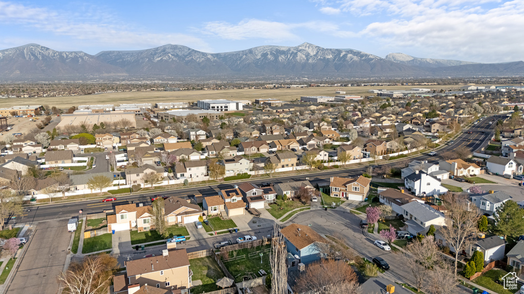Drone / aerial view featuring a mountain view and a residential view