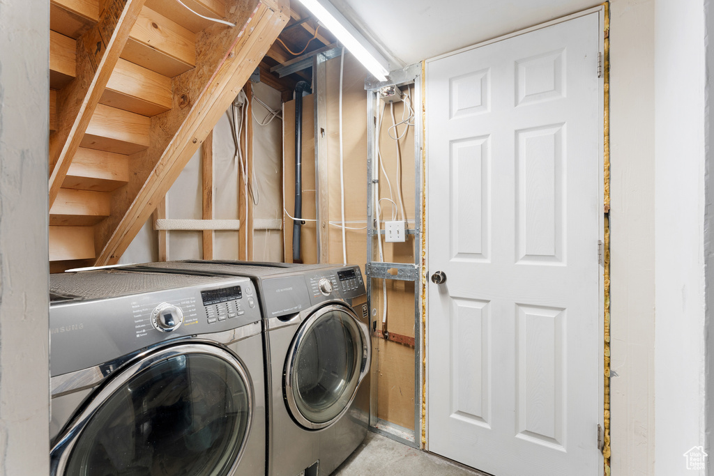 Washroom with separate washer and dryer and laundry area