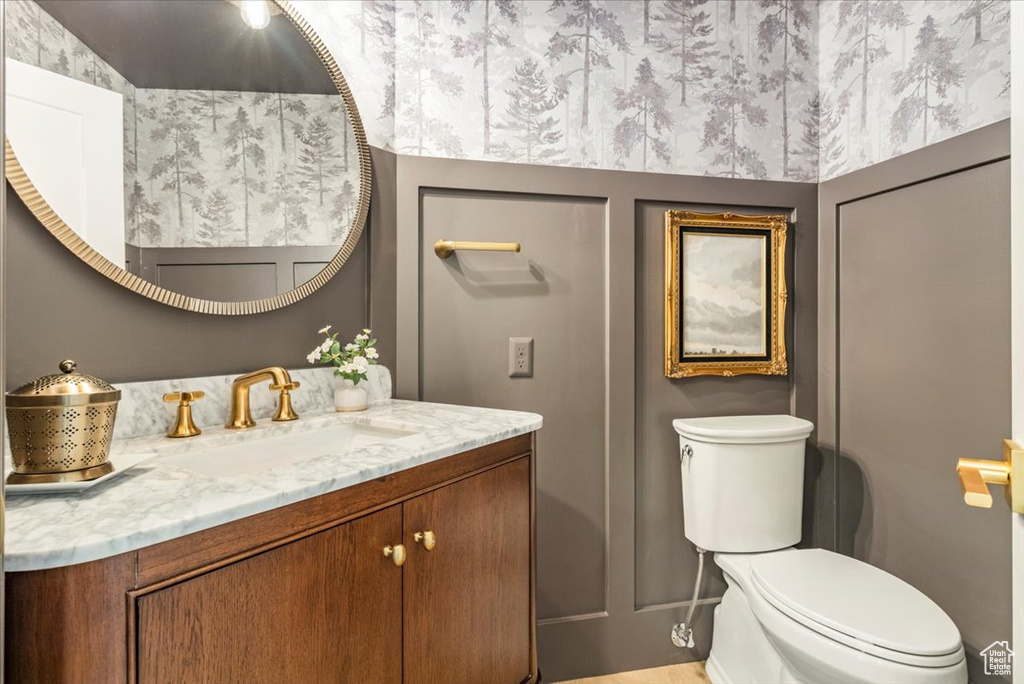 Bathroom with toilet and vanity