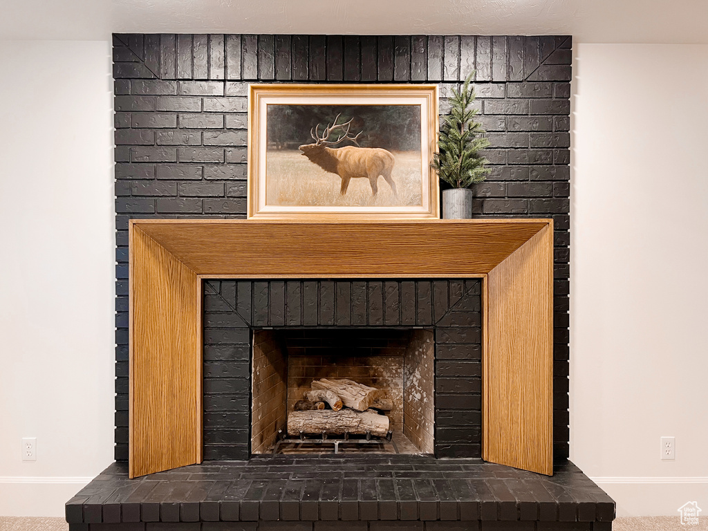 Interior details with a fireplace and baseboards