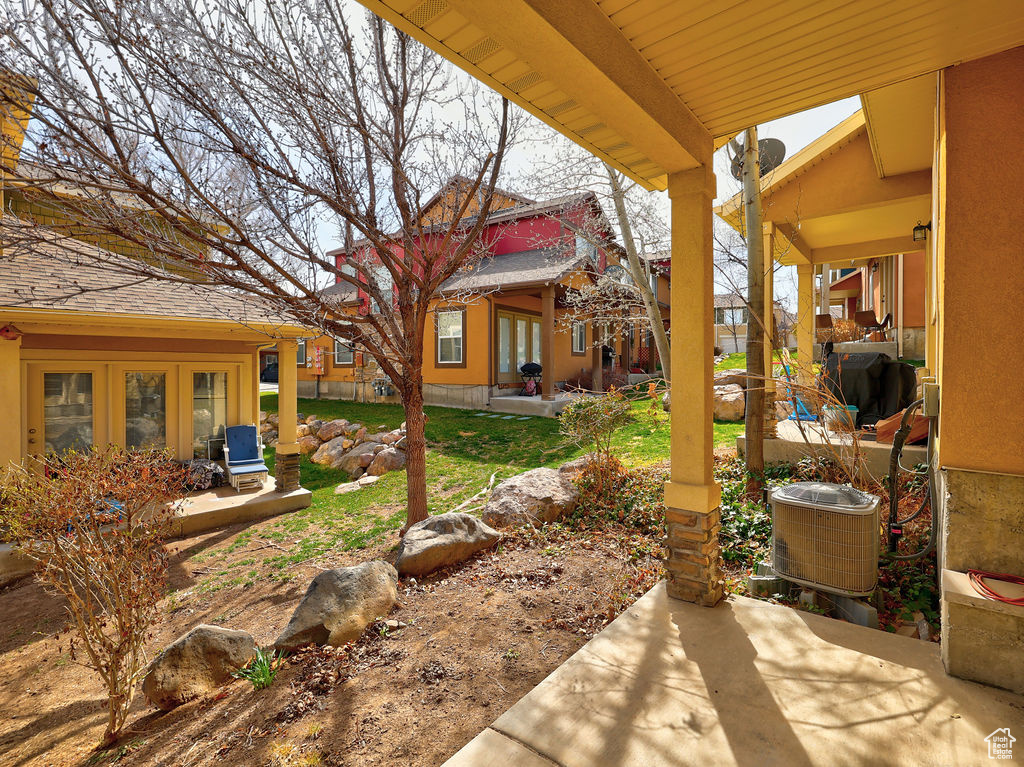 View of yard featuring a patio area and french doors