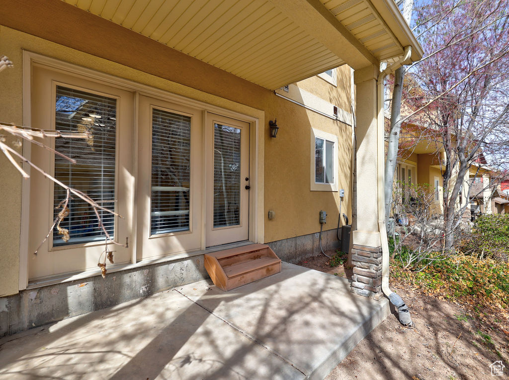 Property entrance with stucco siding