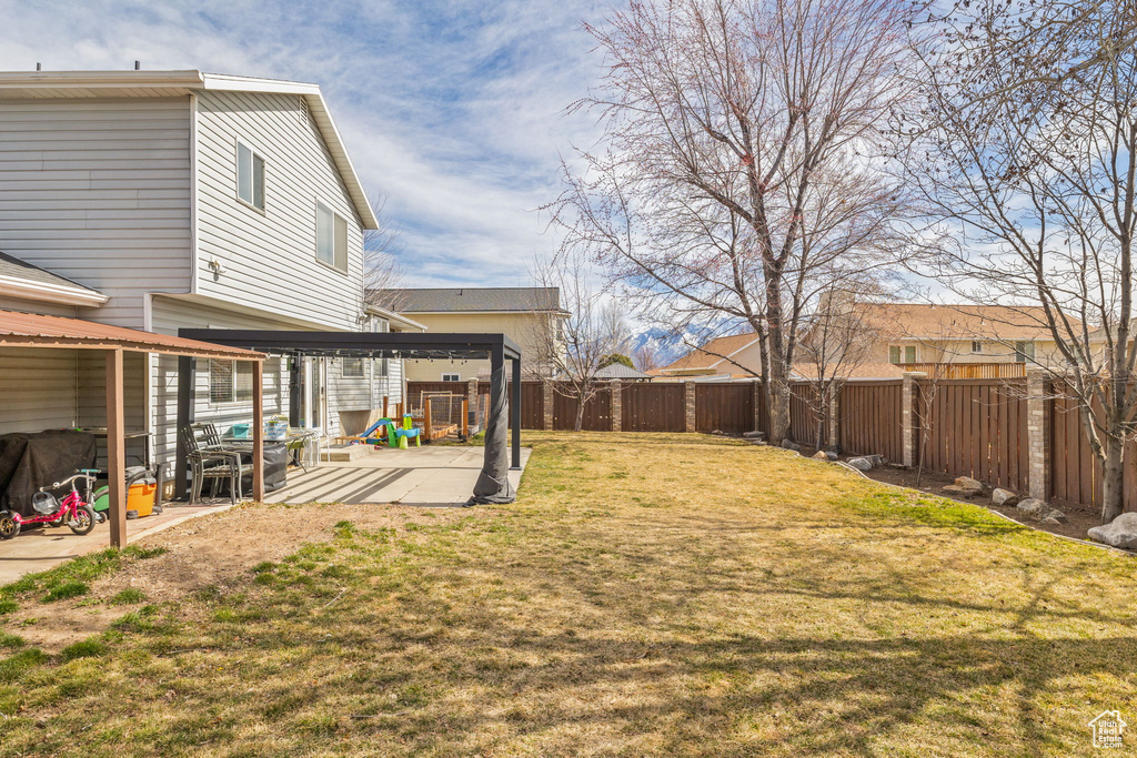 View of yard featuring a patio area and a fenced backyard