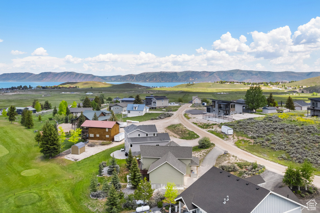 Aerial perspective of suburban area featuring a water and mountain view