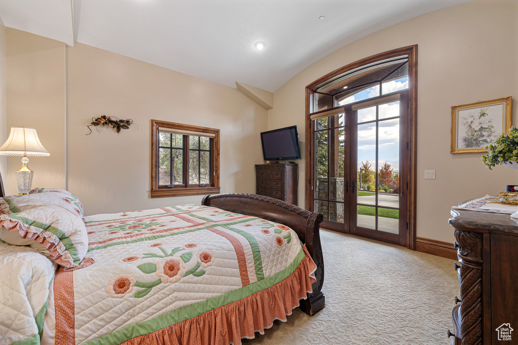 Bedroom with light carpet, access to outside, lofted ceiling, and recessed lighting