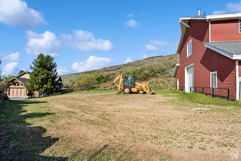 View of yard featuring a mountain view and a garage