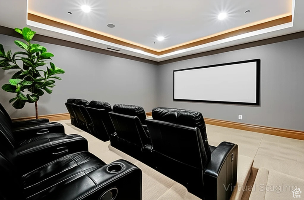 Home theater featuring a raised ceiling and recessed lighting