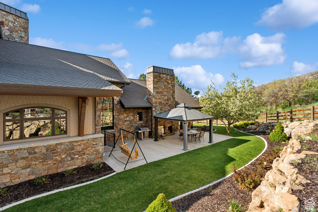 View of yard with a patio and a gazebo