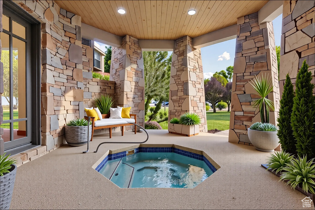 View of pool featuring a hot tub