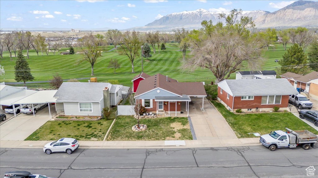 Birds eye view of property featuring golf course view and a mountain view