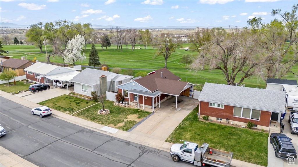 Aerial view featuring golf course view and a residential view