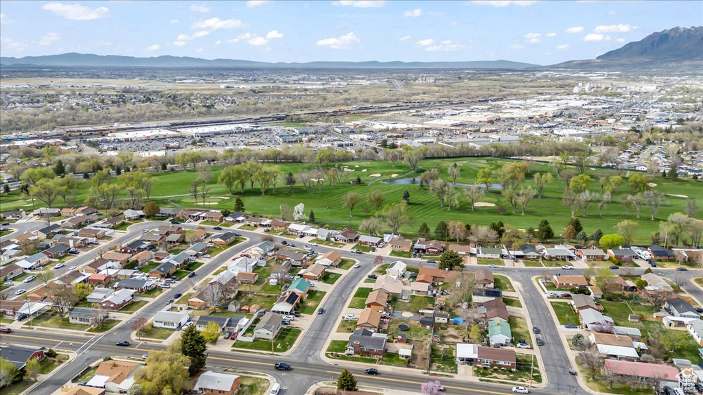 Birds eye view of property with view of golf course and a residential view