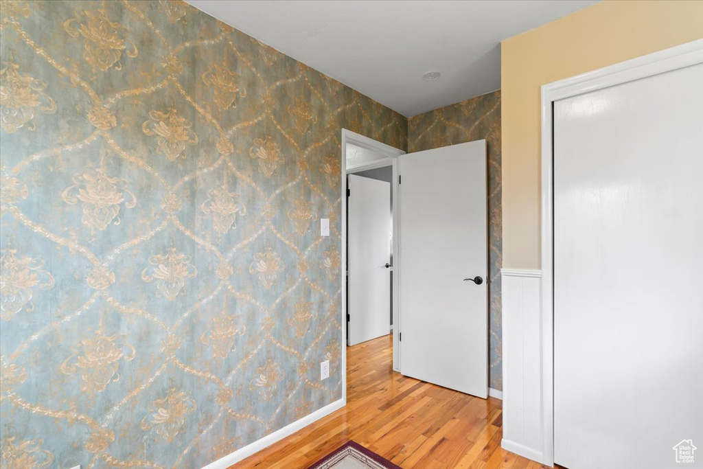 Unfurnished bedroom featuring a closet and light wood finished floors