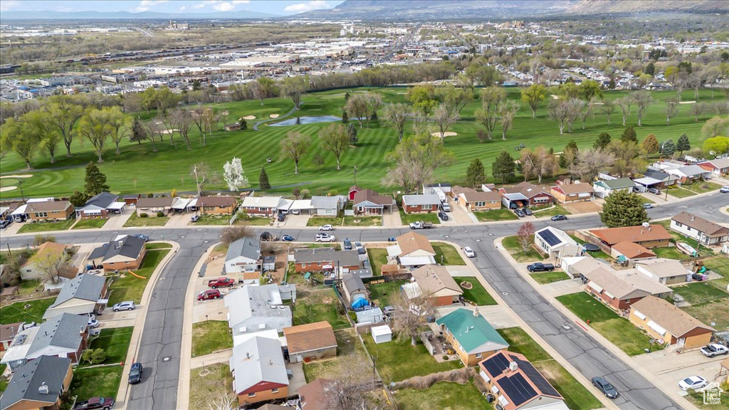 Aerial view featuring a mountain view, golf course view, and a residential view