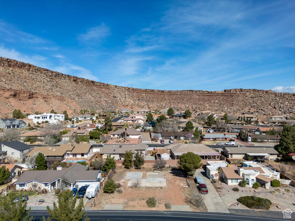 Birds eye view of property with a residential view and a mountain view