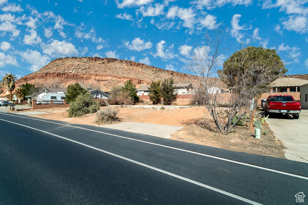 View of street with a residential view and a mountain view