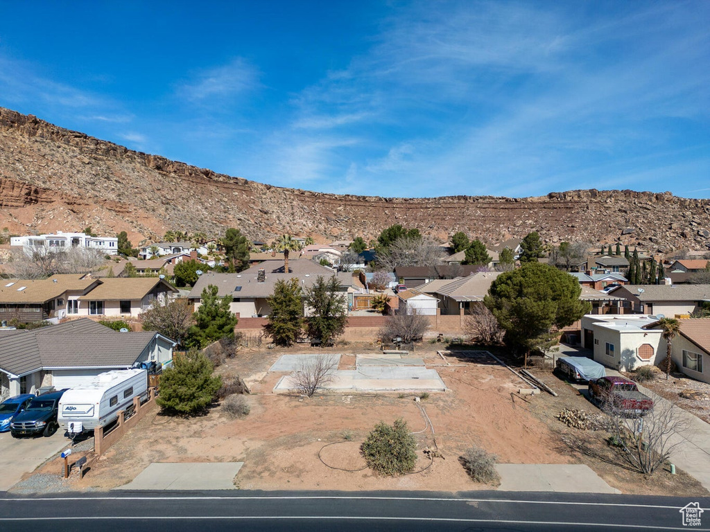 Birds eye view of property with a residential view and a mountain view