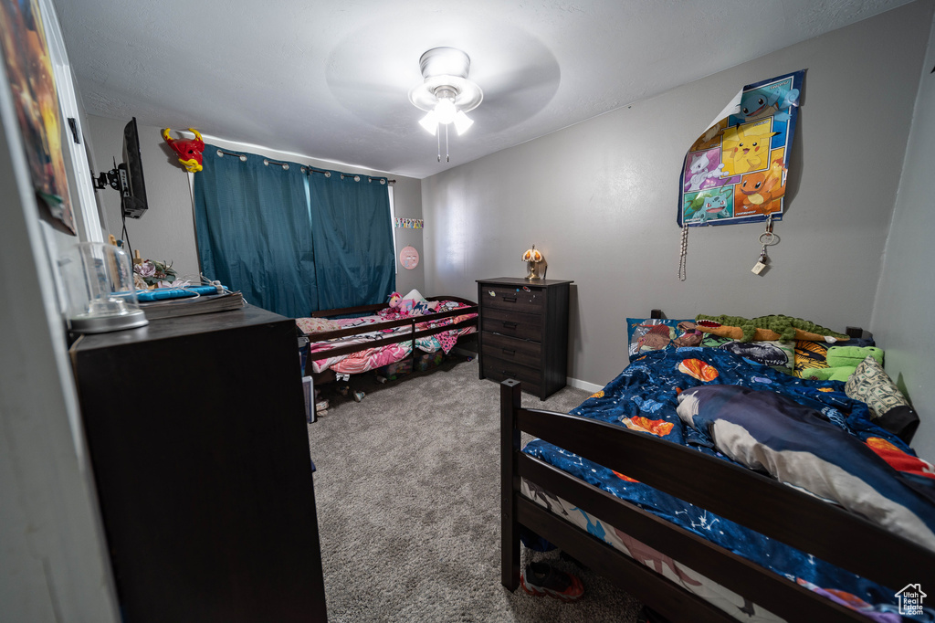 Bedroom featuring carpet and ceiling fan