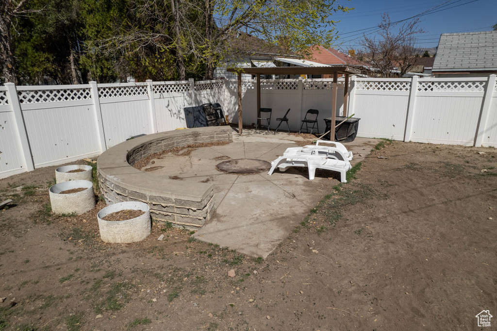 View of patio with a fenced backyard