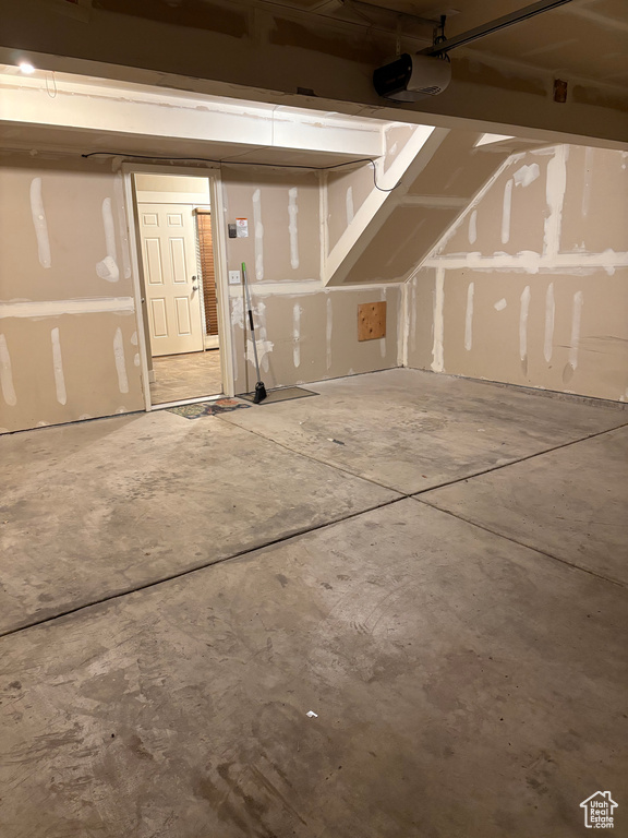 Garage featuring a garage door opener