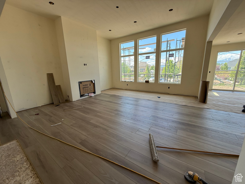 Unfurnished living room featuring wood finished floors