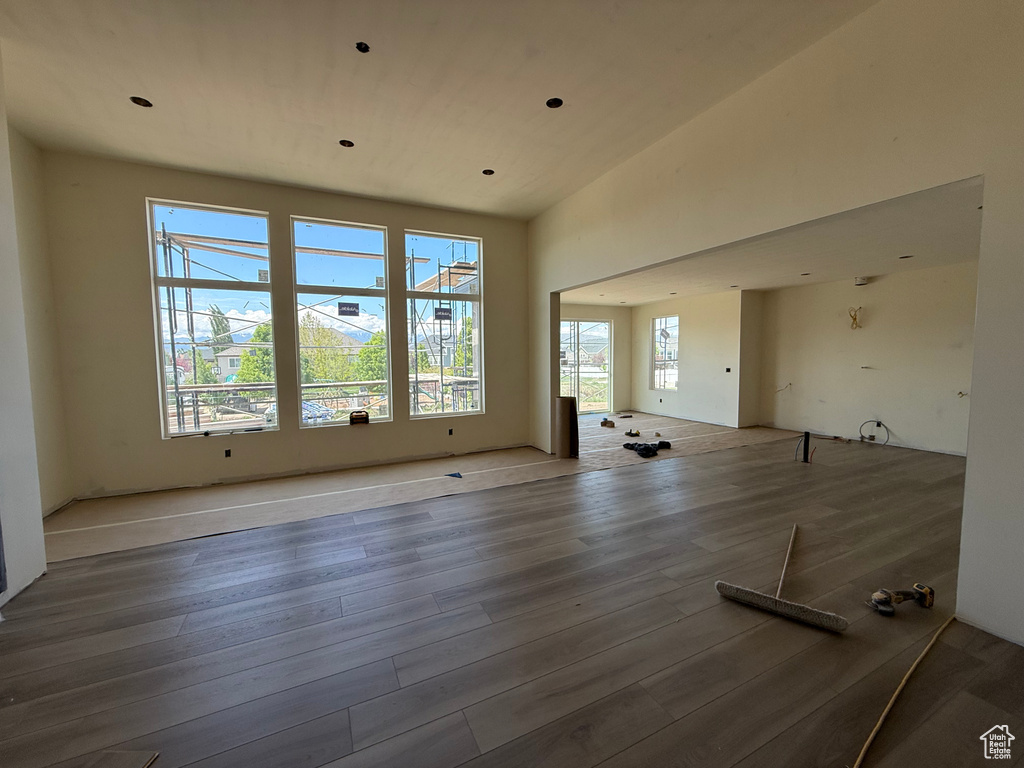 Unfurnished living room with wood finished floors