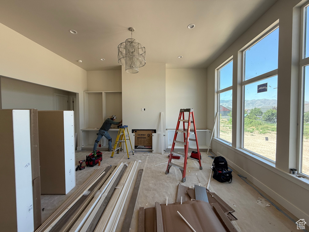 Recreation room with a chandelier and recessed lighting