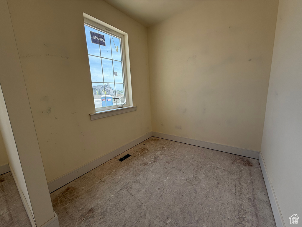 Empty room featuring baseboards
