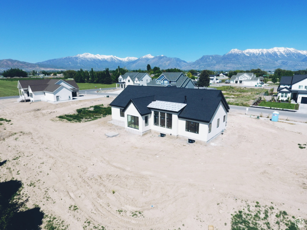 View of subject property with a mountainous background