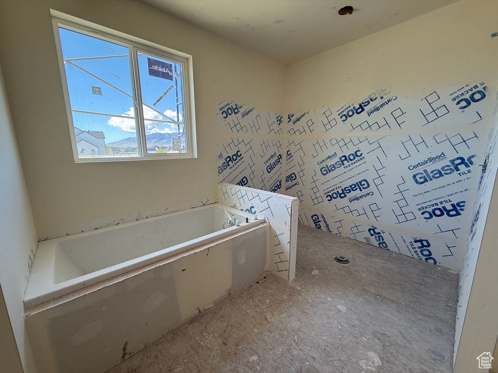 Full bath featuring a bath