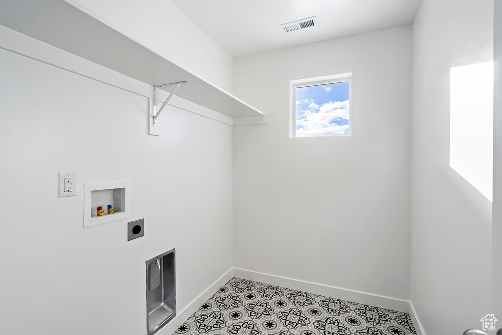 Laundry area featuring visible vents, baseboards, washer hookup, laundry area, and hookup for an electric dryer