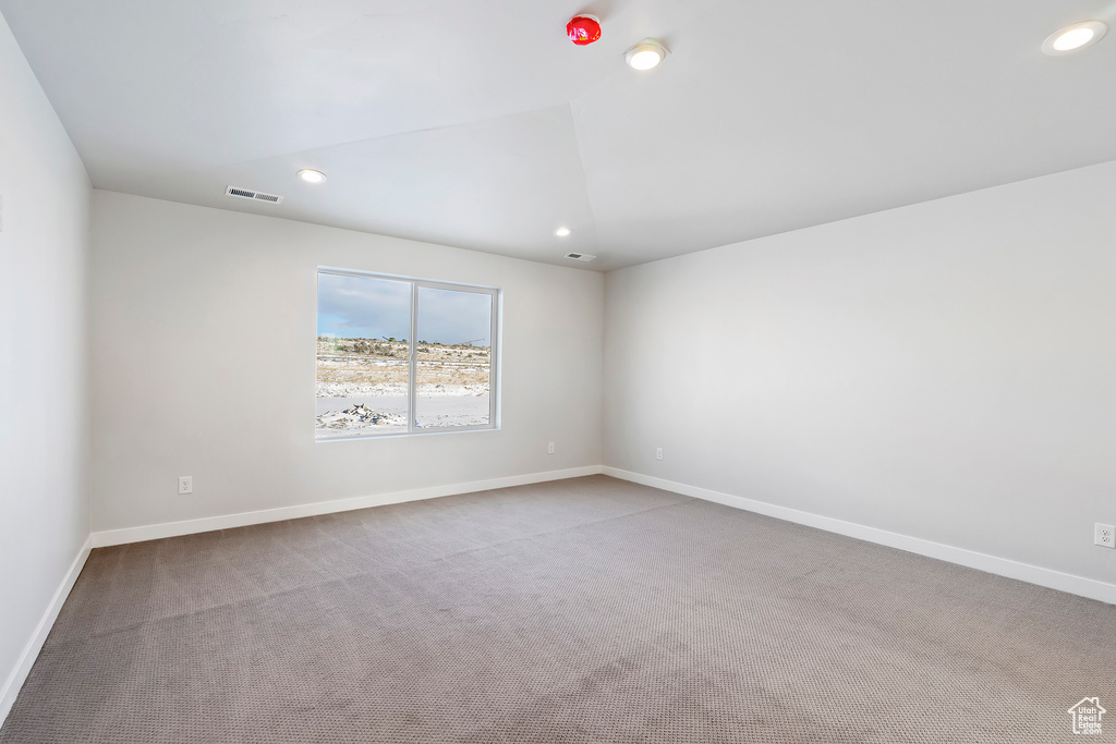Spare room with recessed lighting, visible vents, and carpet floors