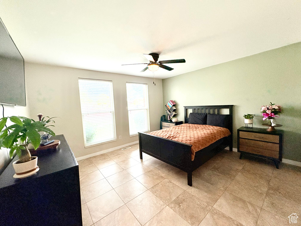 Bedroom with baseboards and a ceiling fan
