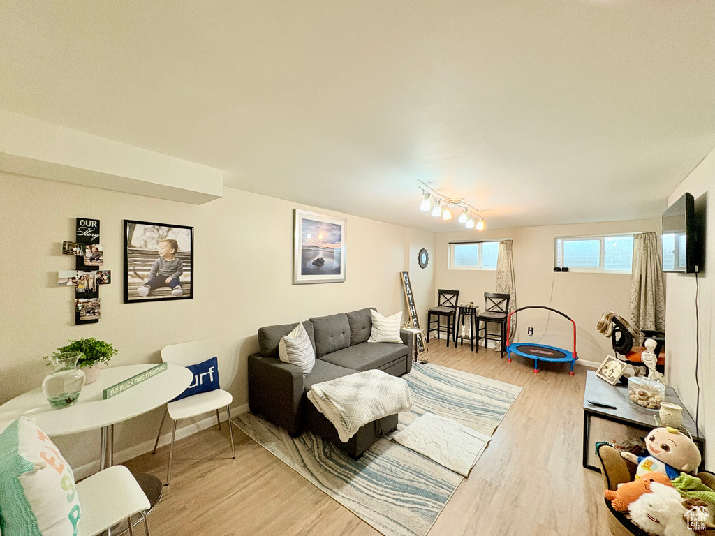 Living room featuring baseboards and light wood finished floors